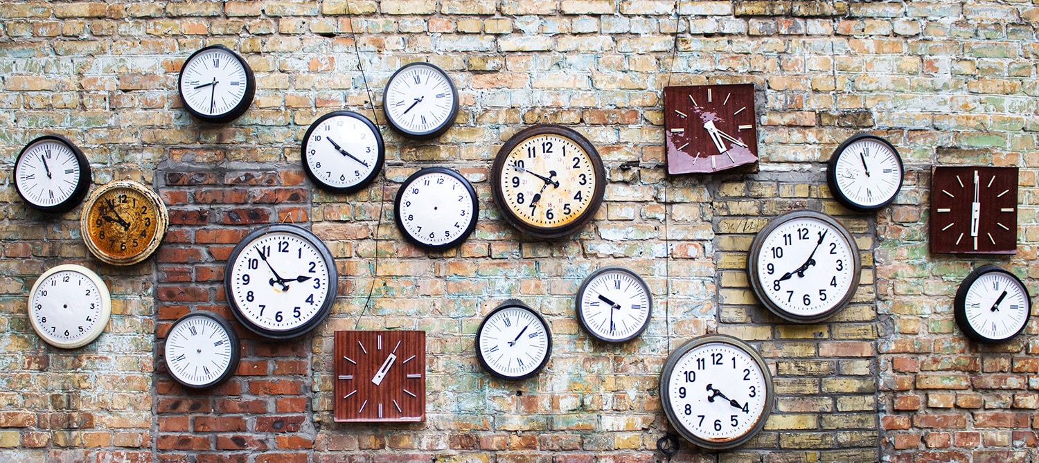 brick wall with clocks
